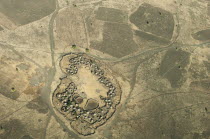 Uganda, Karamoja, Aerial views down on a traditional manyatta cattle korral.