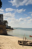 Tanzania, Zanzibar, Stone Town, Looking along the golden sands of the beach.