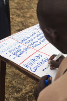 Uganda, Karamoja, Teacher at a workshop to raise awareness about HIV and AIDS prevention.