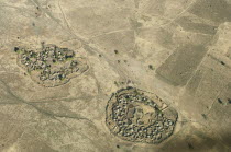 Uganda, Karamoja, Aerial views down on a traditional manyatta cattle korral.