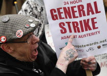 England, London, Sam Brackenbury from Birmingham at a demonstration outside Parliament on budget day 2013 protesting abouit Government cuts and calling for a general strike.  photo by Sean Aid...