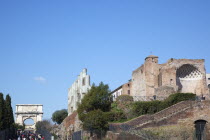 Italy, Lazio, Rome, tourists walking up Via Sacra toward the Arch of Titus on Velian Hill.