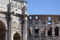 Italy, Lazio, Rome, The Arch of Constantine with the Coliseum behind.