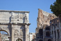 Italy, Lazio, Rome, The Arch of Constantine with the Coliseum behind.