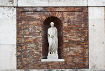 Italy, Lazio, Rome, Niche statue in the walls beneath Piazza del Quirinale.