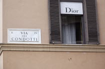 Italy, Lazio, Rome, Via del Condotti, Street sign on the Christian Dior shop next to the Spanish Steps. **Editorial Use Only**