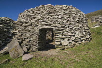 Ireland, County Kerry, Dingle Peninsula, Beehive hut in the Fahan Group.