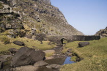 Ireland, County Kerry, Killarney, Gap of Dunloe with old stone bridge crossing mountain stream.
