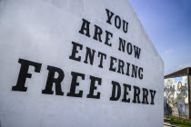 Ireland, Derry, Bogside Nationalist mural 'You Are Now Entering Free Derry' on old gable wall.