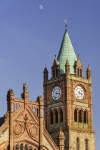 Ireland, Derry, The Guild Hall, The Clock Tower with moon in the sky above.