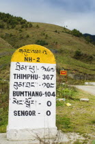Bhutan, Sengor, Milestones on the side of the main east-west highway showing distances to towns