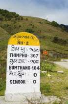 Bhutan, Sengor, Milestones on the side of the main east-west highway showing distances to towns