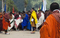 Bhutan, Gangtey Gompa, 4th King of Bhutan leaving after inauguration of new temple; surrounded by ministers, media and police.