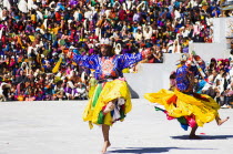 Bhutan, Thimphu Dzong, Dancers in traditional Buddhist costume for the Tsecchu, or Masked Dance.