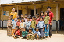 Bangladesh, Bandarban, Students and teachers stood outside a small primary school in a remote area of the Chitagong Hill tracts.
