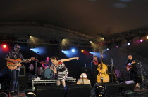 Music Strings, Guitars, Irish Rockabilly singer Imelda May and her band performing at the 2010 Cornbury Festival.