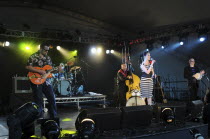 Music Strings, Guitars, Irish Rockabilly singer Imelda May and her band performing at the 2010 Cornbury Festival.