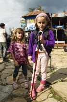 Nepal, Pokhara. Young English girls trekking in Nepali Himalayan hills near Pokhara.