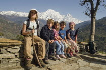 Nepal, Pokhara. Western children trekking in Himalayan Nepali hills near Pokhara.