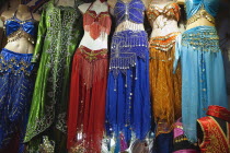 Turkey, Istanbul, Fatih, Sultanahmet, Kapalicarsi, Stall selling traditional clothing in the Grand Bazaar.
