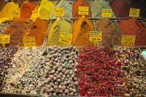 Turkey, Istanbul, Fatih, Eminou, Misir Carsisi, Display of various spices and dried teas in the Spice market.