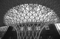 England, London, B&W shot of the metal structure inside Kings Cross Railway Station.