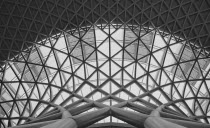 England, London, B&W shot of the metal structure inside Kings Cross Railway Station.