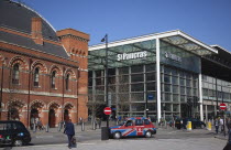 England, London, Taxi cabs outside the entrance to St Pancras Railway Station.