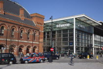 England, London, Taxi cabs outside the entrance to St Pancras Railway Station.