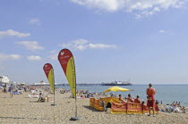 England, East Sussex, Brighton, Lifeguards on the beach.