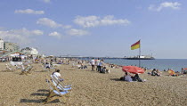 England, East Sussex, Birghton, View along the beach to Pier.