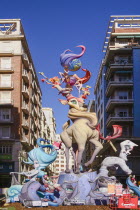 Spain, Valencia Province, Valencia, Typical falla scene with Papier Mache figures in the street during Las Fallas festival.