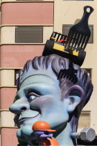 Spain, Valencia Province, Valencia, Papier Mache figure in the street during Las Fallas festival, Detail of face.