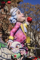 Spain, Valencia Province, Valencia, Papier Mache figure in the street during Las Fallas festival.