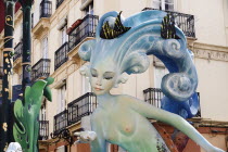 Spain, Valencia Province, Valencia, Papier Mache figure of mermaid in the street during Las Fallas festival.