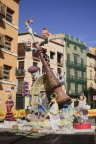 Spain, Valencia Province, Valencia, Falla scene with Papier Mache figures in the streets of the Carmen district during Las Fallas festival.
