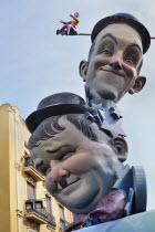 Spain, Valencia Province, Valencia, Papier Mache versions of Laurel and Hardy in the street during Las Fallas festival.