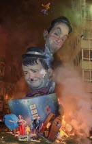 Spain, Valencia Province, Valencia, La Crema, The Burning of the Papier Mache figures in the street during Las Fallas festival on March 19th, Laurel and Hardy going up in flames.