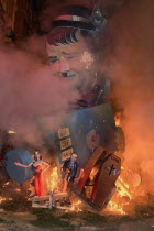 Spain, Valencia Province, Valencia, La Crema, The Burning of the Papier Mache figures in the street during Las Fallas festival on March 19th, Oliver Hardy going up in flames.