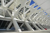 Spain, Valencia Province, Valencia, La Ciudad de las Artes y las Ciencias, City of Arts and Sciences, Principe Felipe Science Museum,  Detail of the building with red Mercedes car protrudng from one o...