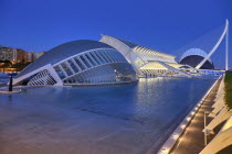 Spain, Valencia Province, Valencia, La Ciudad de las Artes y las Ciencias, City of Arts and Sciences, Overall vista of the complex of buildings at dusk.