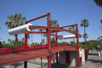 Spain, Catalonia, Barcelona, El Barri Gotic, Red pedestrian Bridge over Rhonda del Litoral.