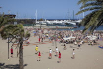 Spain, Catalonia, Barcelona, Barceloneta, Playa de St Sebastia, view along beach toward Port Olimpic.