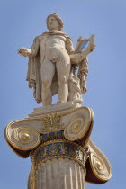 Greece, Attica, Athens, Statue of Apollo outside the Academy of Arts.