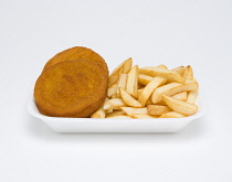 Food, Cooked, Fish, deep fried fishcakes and potato chips in an insulated polystyrene foam tray on a white background.