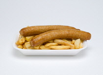 Food, Cooked, Meat, Two fried pork sausages and potato chips in an insulated polystyrene foam tray on a white background.