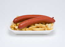 Food, Cooked, Meat, Two saveloys with potato chips in an insulated polystyrene foam tray on a white background.