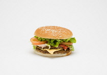 Food, Cooked, Meat, Double cheesburger with salad and tomato ketchup in a bun on a white background.