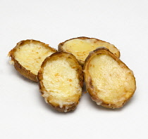 Food, Cooked, Vegetables, Baked potatoes cut in half with melted cheese on a white background.