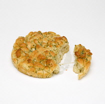 Food, Cooked, Bread, Torn loaf of cheese and herb tear and share bread on a white background.